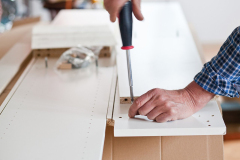 Man Assembling Flat Pack Furniture